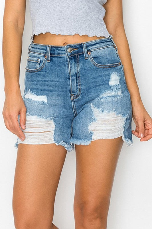 highly distressed medium blue denim cut of shorts with frayed hem